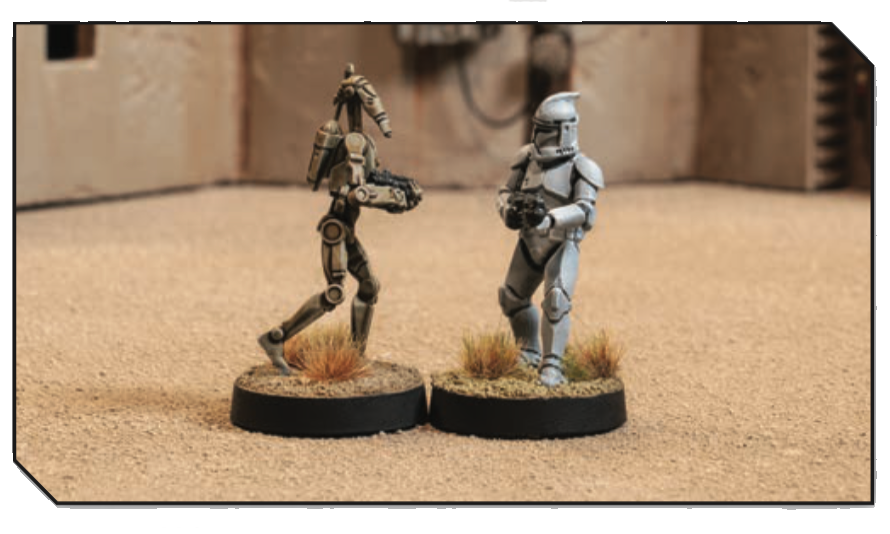 One Clone trooper and one Droid trooper miniature with bases touching physically.